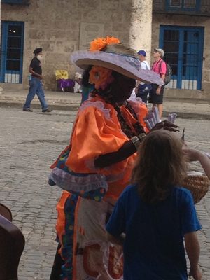 A lady selling "Cones" of peanuts to the tourists.